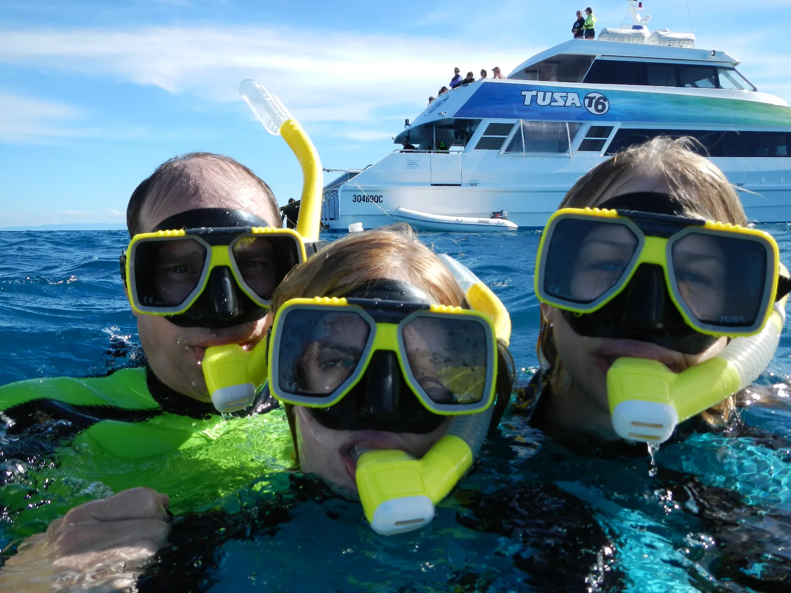 Family snorkeling at the Great Barrier Reef
